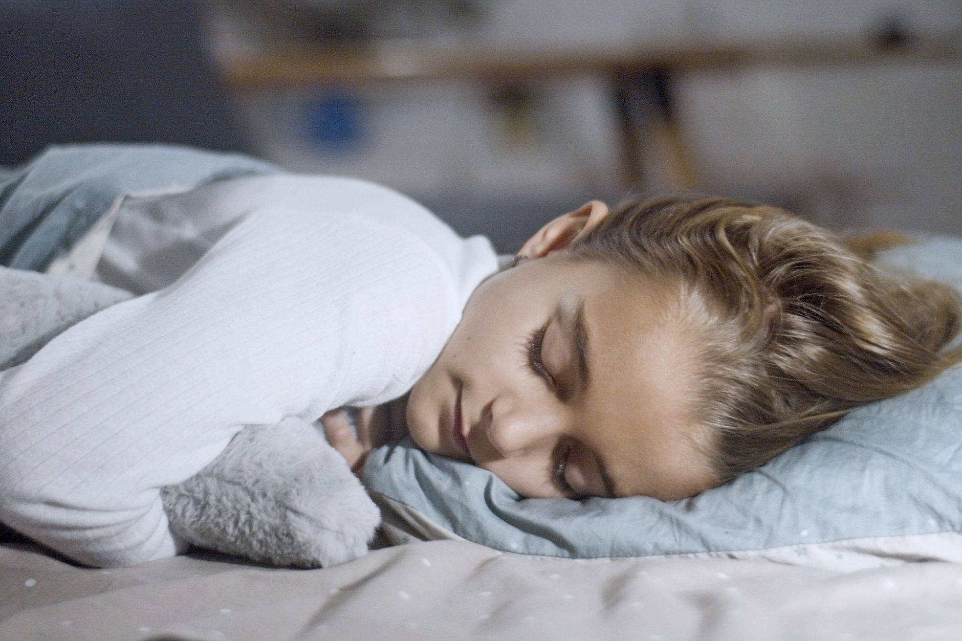 a beautiful girl in white long sleeve shirt sleeping